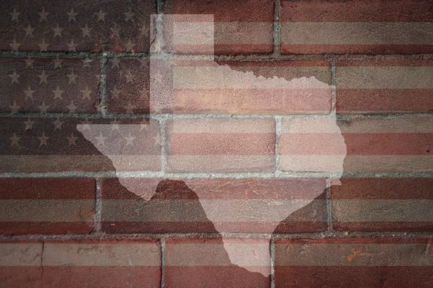 texas outline on bricks painted with american flag