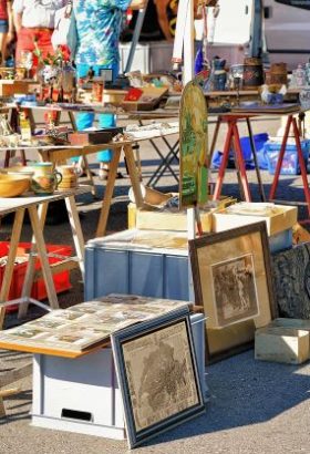 tables of antiques at flea market